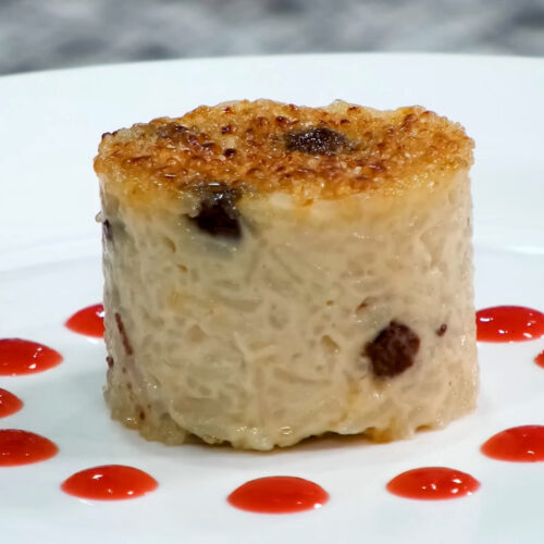 Rice Pudding Brulee with strawberry coulis